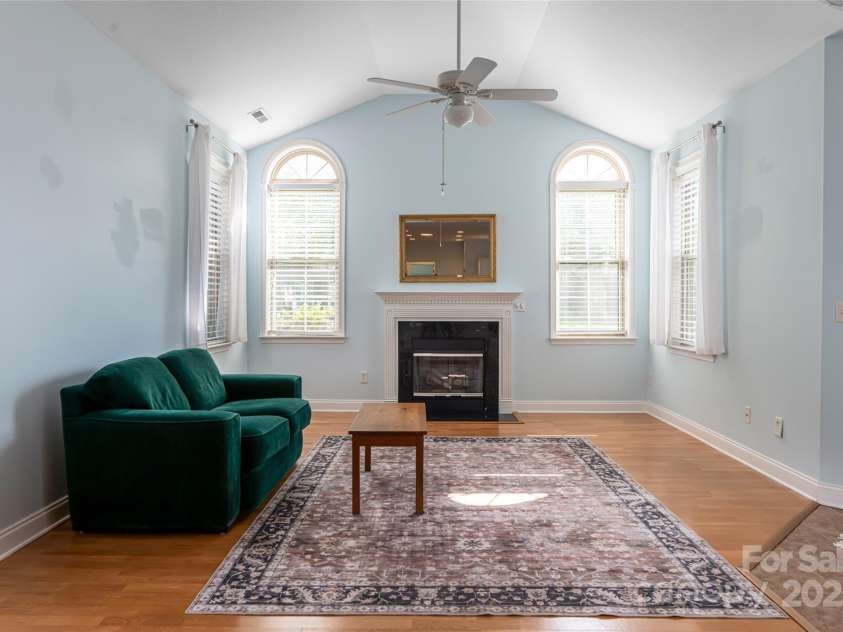 55 Outlook Circle, Swannanoa, NC 28778.  MLS# CAR4267011, YatesRealty ID 20219. Relax by the gas fireplace in the light filled living room.