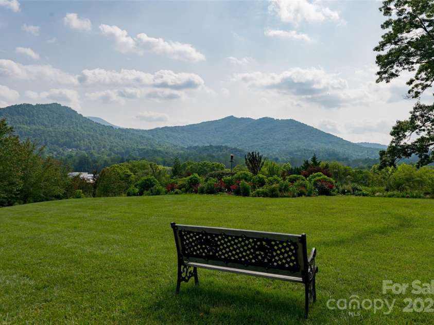 55 Outlook Circle, Swannanoa, NC 28778.  MLS# CAR4267011, YatesRealty ID 20219. Take a rest at the community gardens overlooking the beautiful mountains.