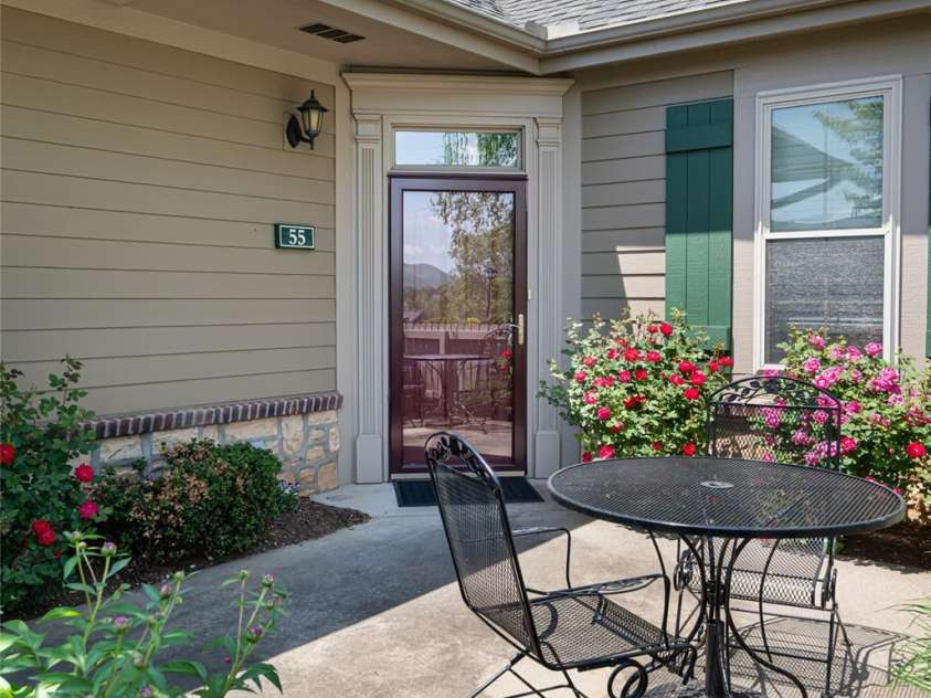 55 Outlook Circle, Swannanoa, NC 28778.  MLS# CAR4267011, YatesRealty ID 20219. The patio at 55 Outlook is a peaceful place full of beautiful perennial flowers - early spring view