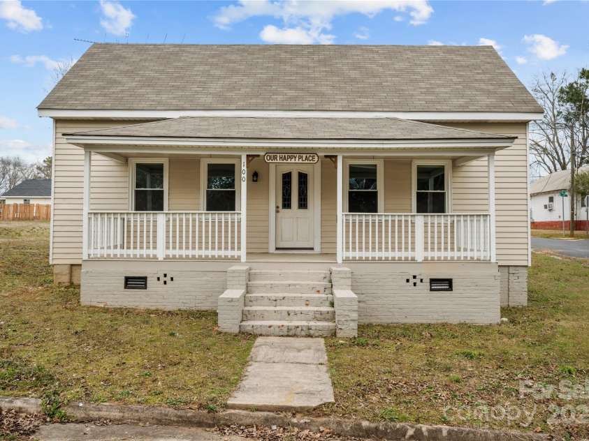 100 Lear Street, Rockingham, NC 28379.  MLS# CAR4223540, YatesRealty ID 2022. Large Rocking Chair Front Porch