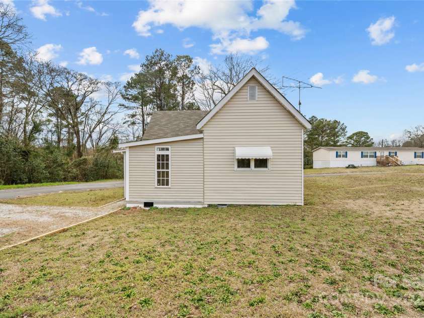 100 Lear Street, Rockingham, NC 28379.  MLS# CAR4223540, YatesRealty ID 2022. Rear yard