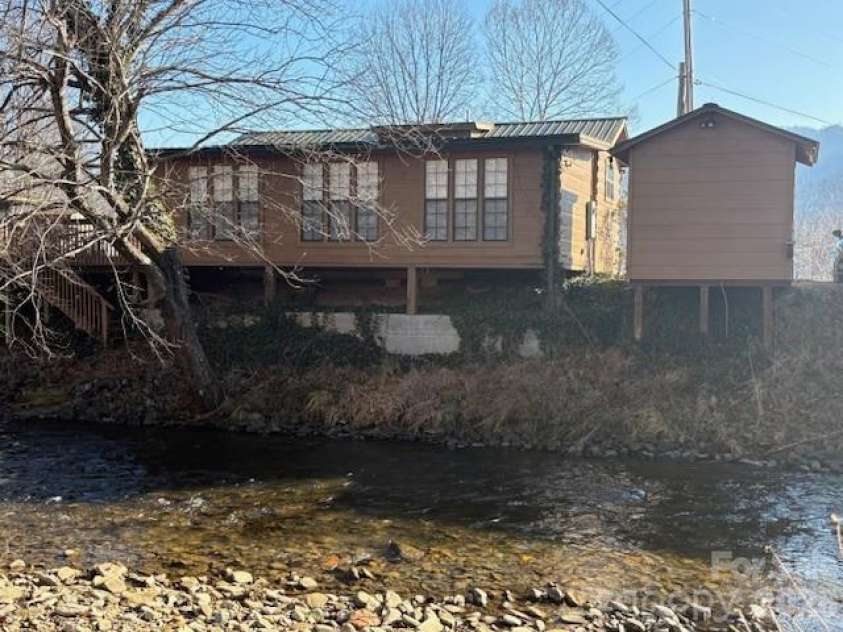 129 Mallard Loop, Waynesville, NC 28785.  MLS# CAR4335027, YatesRealty ID 2023. Back corner of home