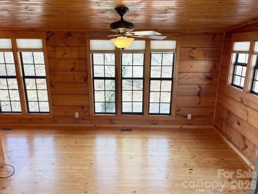 129 Mallard Loop, Waynesville, NC 28785.  MLS# CAR4335027, YatesRealty ID 2023. Back side of family room