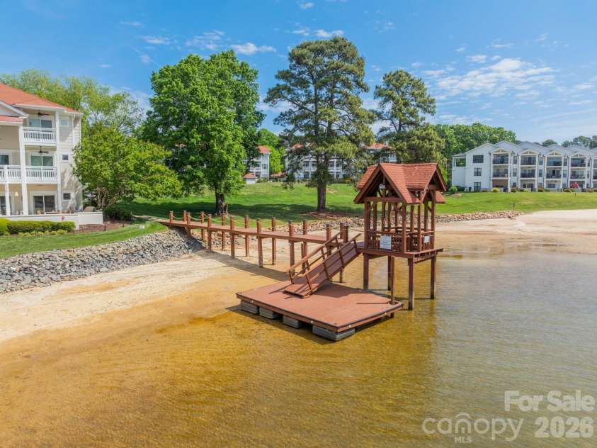 17919 Kings Point Drive, Cornelius, NC 28031.  MLS# CAR4372495, YatesRealty ID 20233. The community day dock from another angel