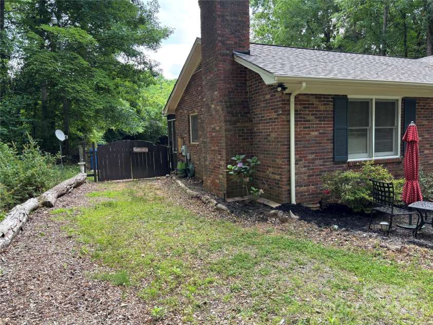 7316 Truelight Church Road, Mint Hill, NC 28227.  MLS# CAR4263547, YatesRealty ID 20233. Left side of home
