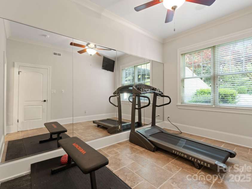 200 Highland Forest Drive, Charlotte, NC 28270.  MLS# CAR4242053, YatesRealty ID 20236. Basement level guest bedroom with ensuite bathroom (currently used as an exercise room).