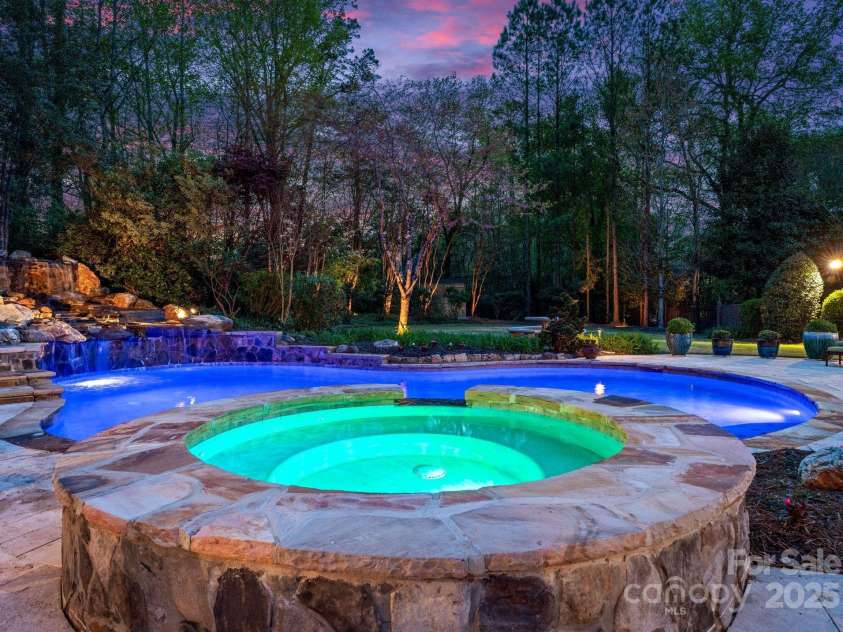 200 Highland Forest Drive, Charlotte, NC 28270.  MLS# CAR4242053, YatesRealty ID 20236. Custom 25x40 heated saltwater pool with a hot tub and waterfall feature.