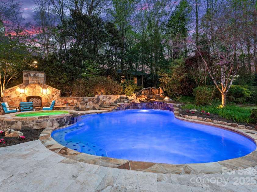 200 Highland Forest Drive, Charlotte, NC 28270.  MLS# CAR4242053, YatesRealty ID 20236. Custom 25x40 heated saltwater pool with a hot tub and waterfall feature.