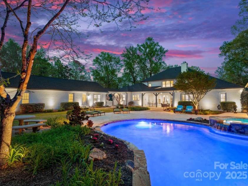 200 Highland Forest Drive, Charlotte, NC 28270.  MLS# CAR4242053, YatesRealty ID 20236. Custom 25x40 heated saltwater pool with a hot tub and waterfall feature.