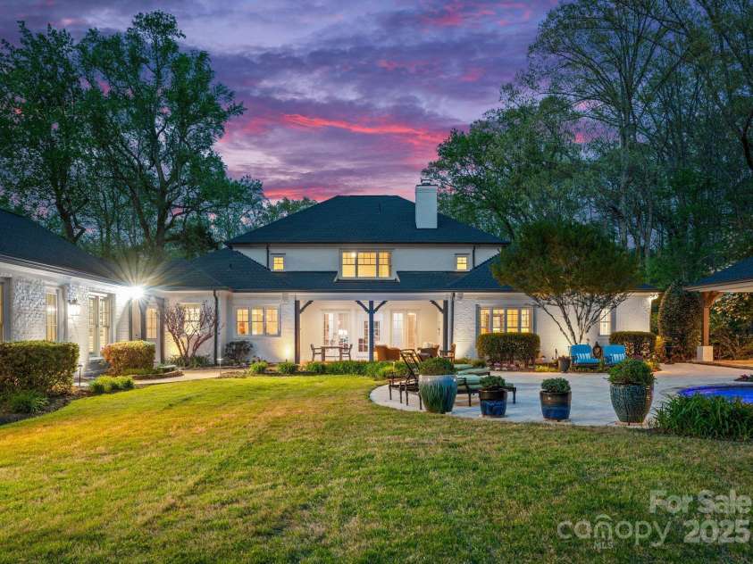 200 Highland Forest Drive, Charlotte, NC 28270.  MLS# CAR4242053, YatesRealty ID 20236. Exterior view of backyard showcasing lush and carefully maintained landscaping.