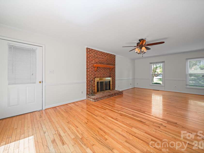 6520 Dougherty Drive, Charlotte, NC 28213.  MLS# CAR4377449, YatesRealty ID 20248. Living room with fireplace