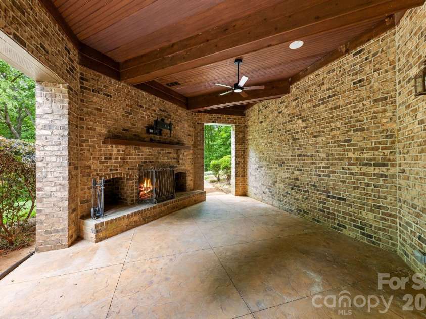 3565 Trinity Church Drive, Concord, NC 28027.  MLS# CAR4373119, YatesRealty ID 20249. Lower level Fireplace and Covered Patio