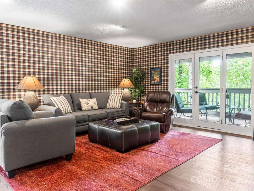 3701 Timber Trail, Asheville, NC 28804.  MLS# CAR4266377, YatesRealty ID 20250. Lower level family room