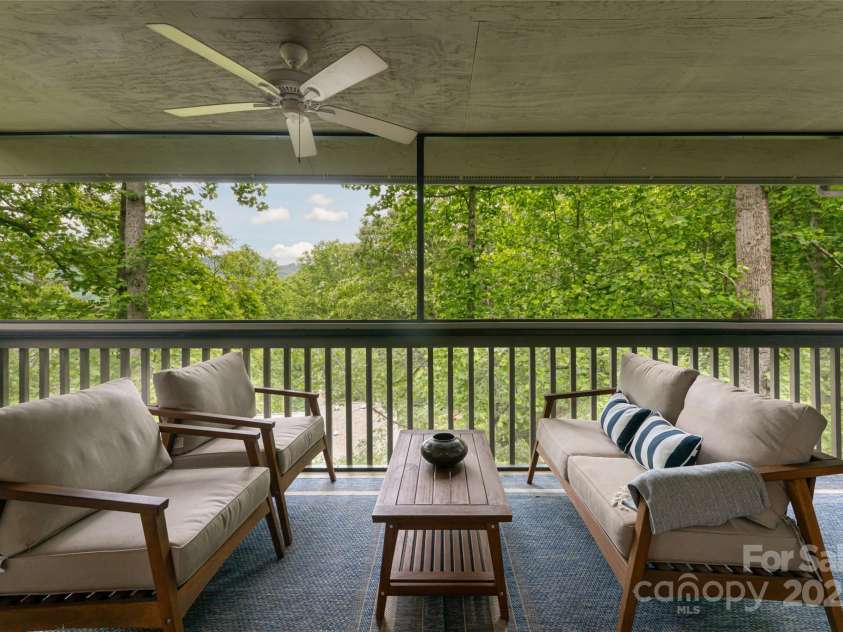 3701 Timber Trail, Asheville, NC 28804.  MLS# CAR4266377, YatesRealty ID 20250. Main level screened porch