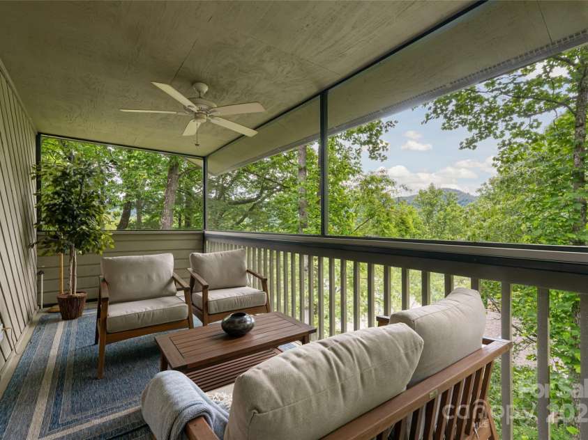 3701 Timber Trail, Asheville, NC 28804.  MLS# CAR4266377, YatesRealty ID 20250. Main level screened porch