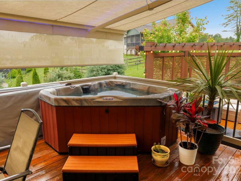 288 Ollie Weaver Road, Weaverville, NC 28787.  MLS# CAR4269198, YatesRealty ID 20259. American spa jetted hot tub with privacy shade