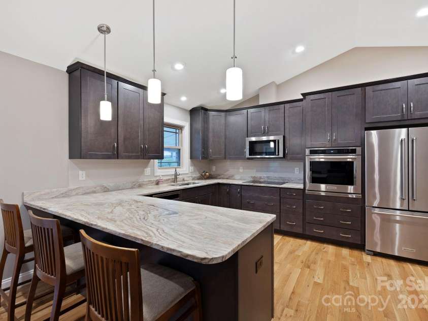 288 Ollie Weaver Road, Weaverville, NC 28787.  MLS# CAR4269198, YatesRealty ID 20259. Chef's kitchen w/induction appliances