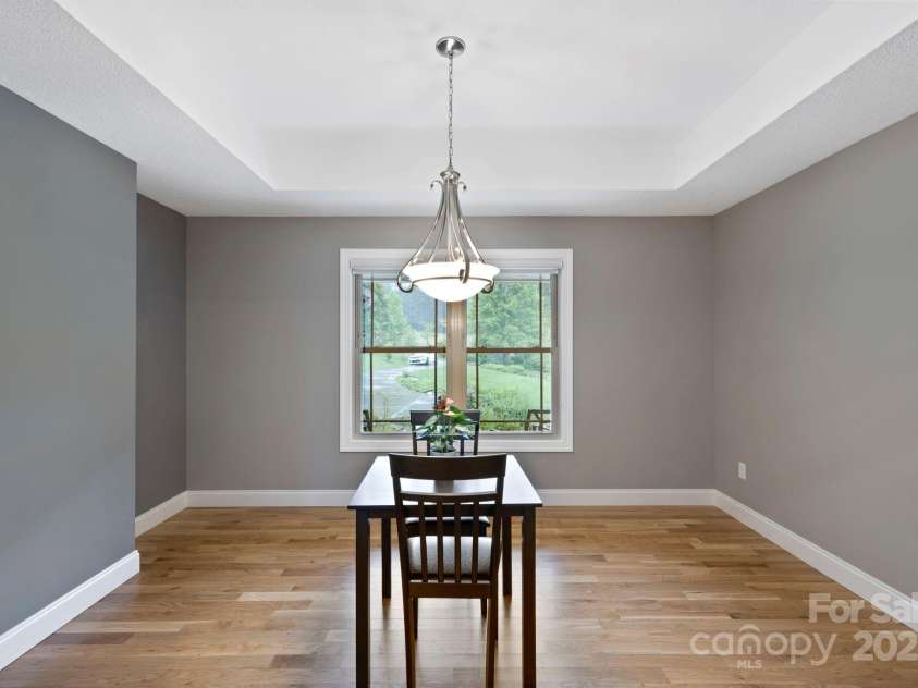 288 Ollie Weaver Road, Weaverville, NC 28787.  MLS# CAR4269198, YatesRealty ID 20259. Dining room w/tray ceiling uplit