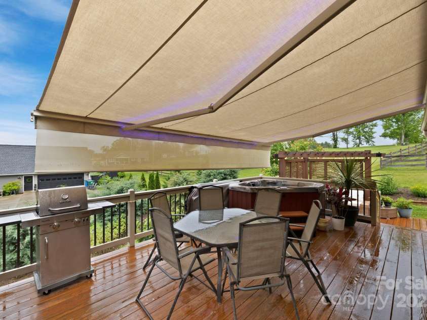 288 Ollie Weaver Road, Weaverville, NC 28787.  MLS# CAR4269198, YatesRealty ID 20259. Dining table w/Sunbrella for shade