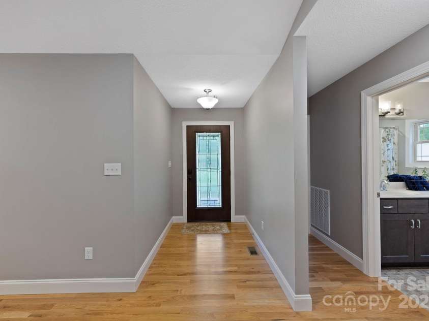 288 Ollie Weaver Road, Weaverville, NC 28787.  MLS# CAR4269198, YatesRealty ID 20259. Front entrance features lighted glass front door