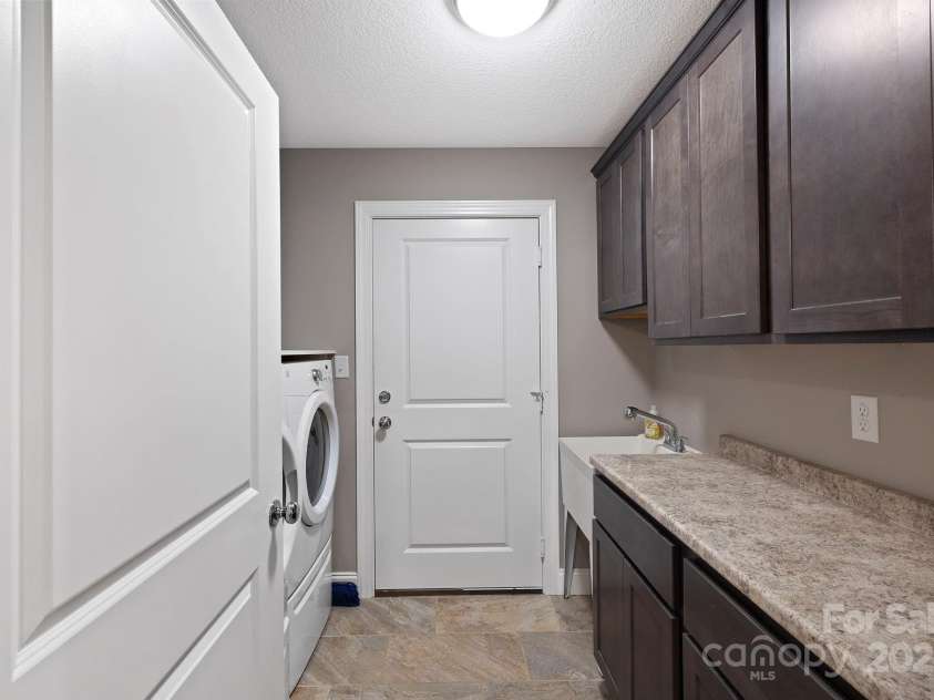 288 Ollie Weaver Road, Weaverville, NC 28787.  MLS# CAR4269198, YatesRealty ID 20259. Great laundry area w/sink/storage