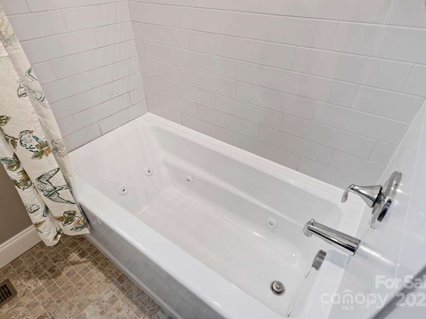 288 Ollie Weaver Road, Weaverville, NC 28787.  MLS# CAR4269198, YatesRealty ID 20259. Jacuzzi jetted bathtub in guest bath