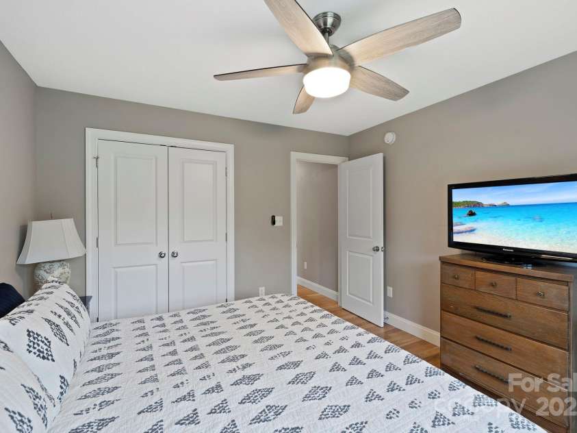 288 Ollie Weaver Road, Weaverville, NC 28787.  MLS# CAR4269198, YatesRealty ID 20259. Natural lighting luminates bedroom