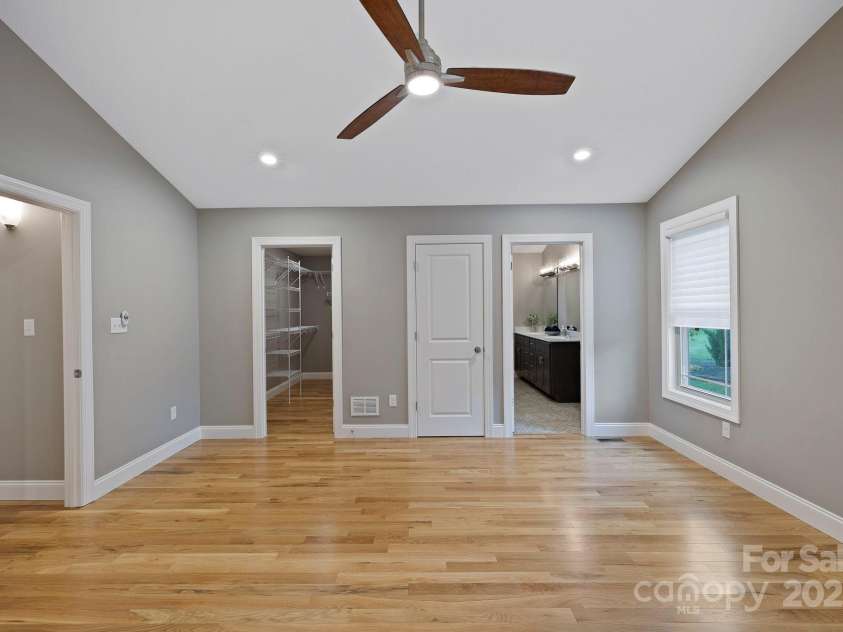 288 Ollie Weaver Road, Weaverville, NC 28787.  MLS# CAR4269198, YatesRealty ID 20259. Primary bedroom w/Luxury Ensuite