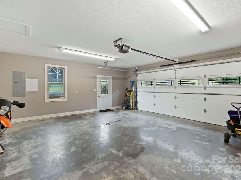 288 Ollie Weaver Road, Weaverville, NC 28787.  MLS# CAR4269198, YatesRealty ID 20259. Spacious two car garage that allows for storage