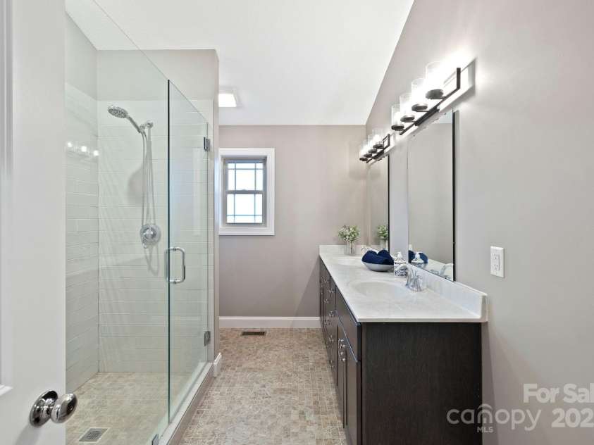 288 Ollie Weaver Road, Weaverville, NC 28787.  MLS# CAR4269198, YatesRealty ID 20259. Subway shower includes tiled bench