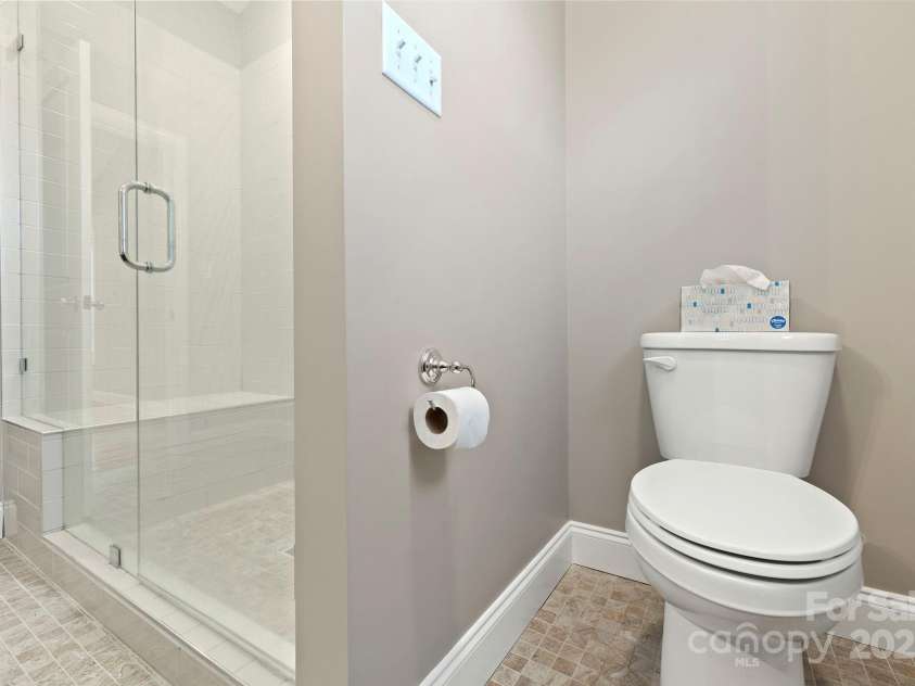 288 Ollie Weaver Road, Weaverville, NC 28787.  MLS# CAR4269198, YatesRealty ID 20259. Subway tiled shower in primary bath