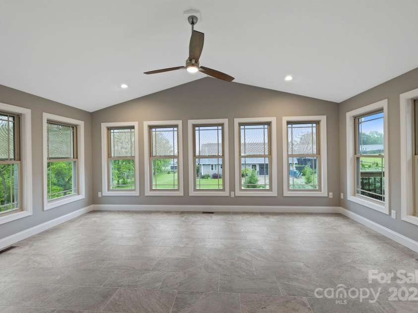 288 Ollie Weaver Road, Weaverville, NC 28787.  MLS# CAR4269198, YatesRealty ID 20259. Sunroom w/mtn views and automatic blinds