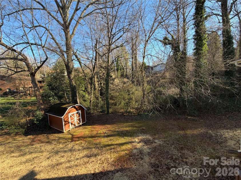 424 Holland Drive, Statesville, NC 28677.  MLS# CAR4335515, YatesRealty ID 2026. Back Yard with Outbuilding