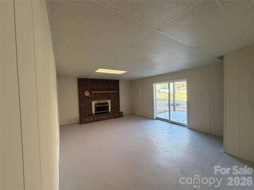 424 Holland Drive, Statesville, NC 28677.  MLS# CAR4335515, YatesRealty ID 2026. Basement with fireplace