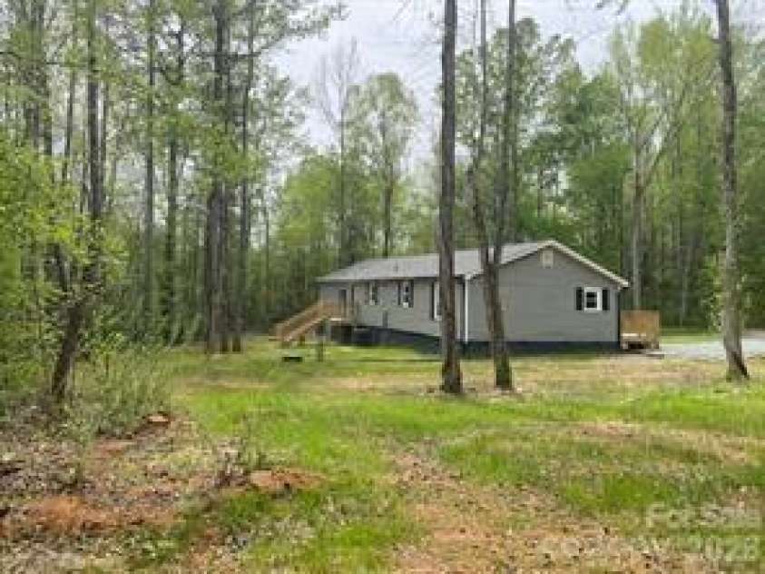 140 Overbrook Road, Salisbury, NC 28147.  MLS# CAR4349590, YatesRealty ID 20263. Back of House and Left End 