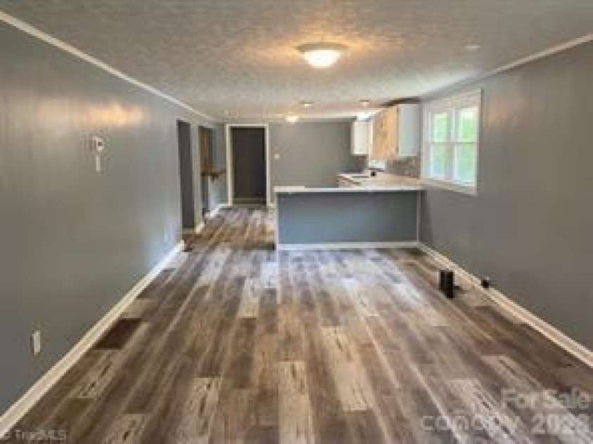 140 Overbrook Road, Salisbury, NC 28147.  MLS# CAR4349590, YatesRealty ID 20263. Living Room to Kitchen