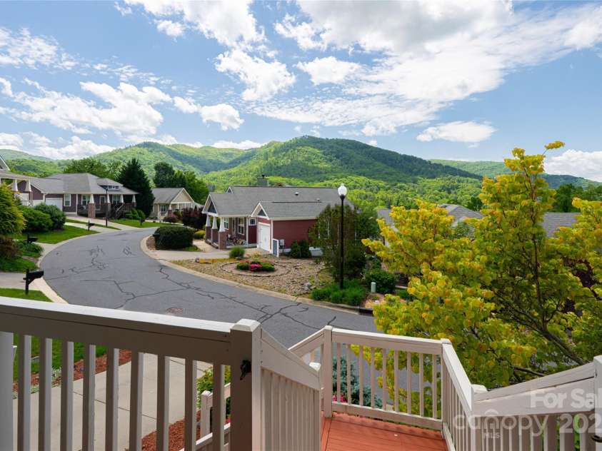 31 Byrdcliffe Lane, Asheville, NC 28805.  MLS# CAR4257639, YatesRealty ID 20268. Views from the front porch