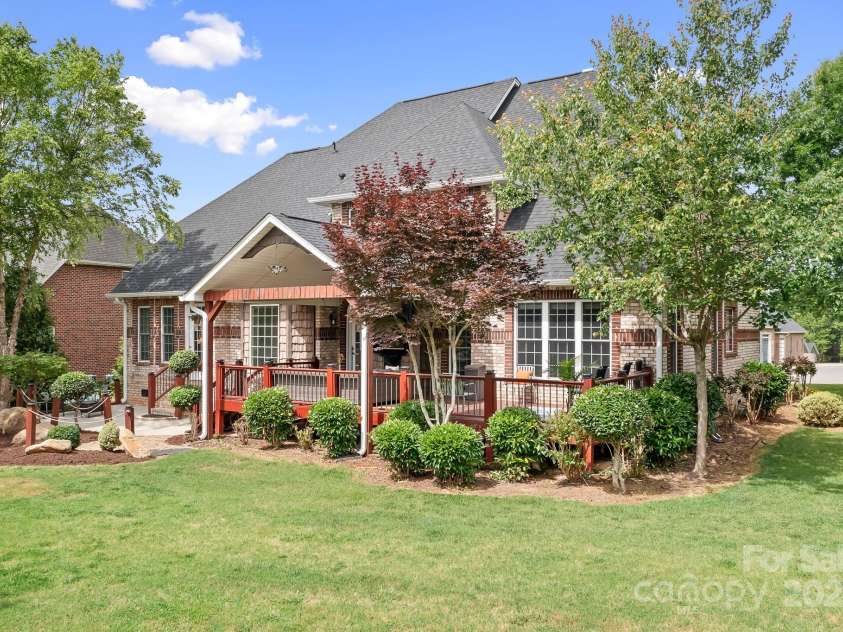 9112 Butterfly Court, Gastonia, NC 28056.  MLS# CAR4267047, YatesRealty ID 20271. Back view from back left corner.