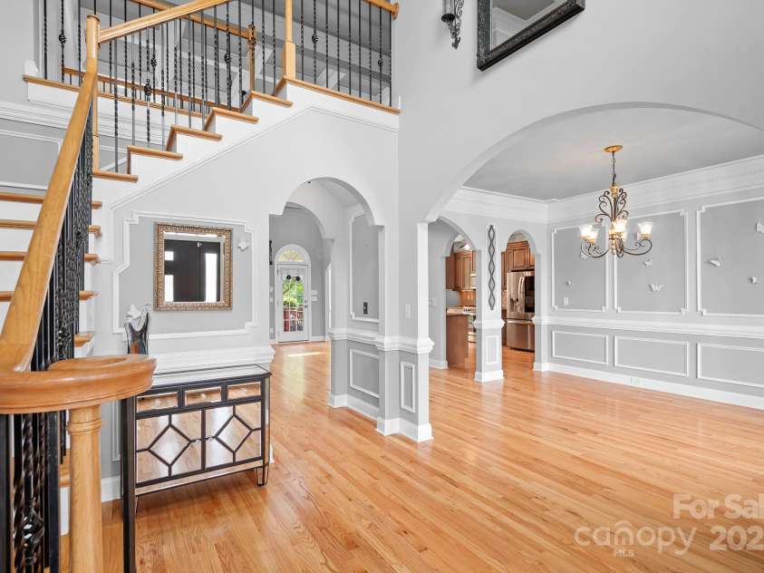 9112 Butterfly Court, Gastonia, NC 28056.  MLS# CAR4267047, YatesRealty ID 20271. From foyer looking into dining room.