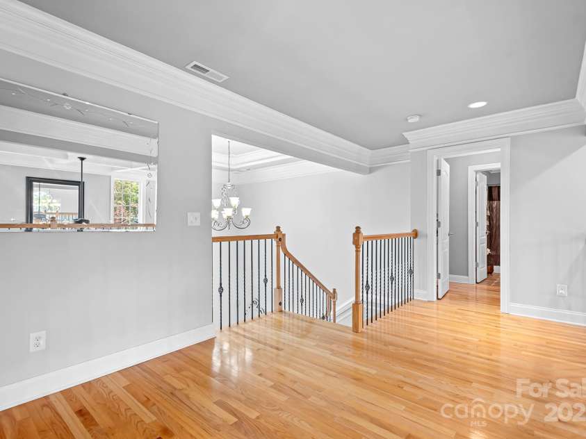 9112 Butterfly Court, Gastonia, NC 28056.  MLS# CAR4267047, YatesRealty ID 20271. Second Floor Overlook looking towards the guest bedroom with ensuite bath and dual closets.