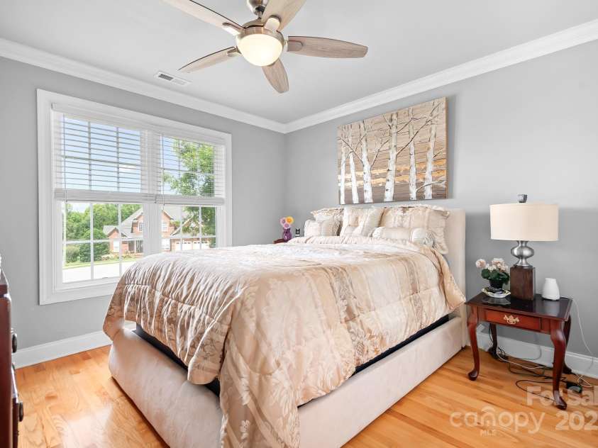 9112 Butterfly Court, Gastonia, NC 28056.  MLS# CAR4267047, YatesRealty ID 20271. Secondary Bedroom # 1 being used as a guest bedroom with Ensuite bathroom.  Sweet Dreams.