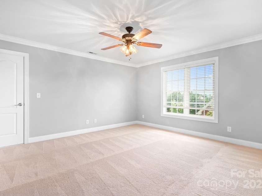 9112 Butterfly Court, Gastonia, NC 28056.  MLS# CAR4267047, YatesRealty ID 20271. Secondary Bedroom # 3 connects directly to bathroom.  That door opens up to a sweet little room that could be secret hideaway for your child or walk in attic storage. It's fairly large and runs the length of the room.