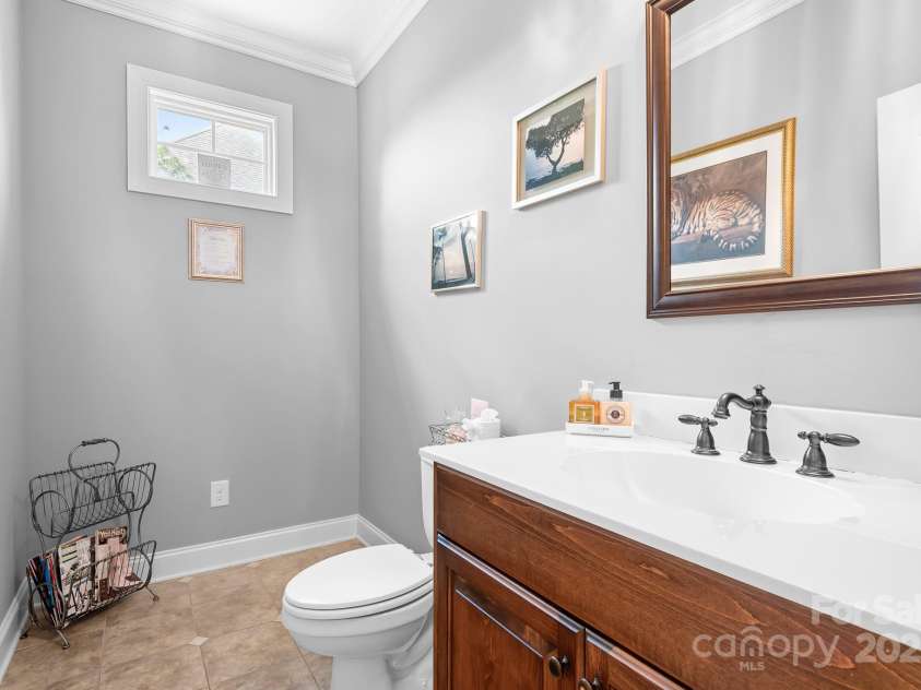 9112 Butterfly Court, Gastonia, NC 28056.  MLS# CAR4267047, YatesRealty ID 20271. Very large half bath on main floor, just off the garage.