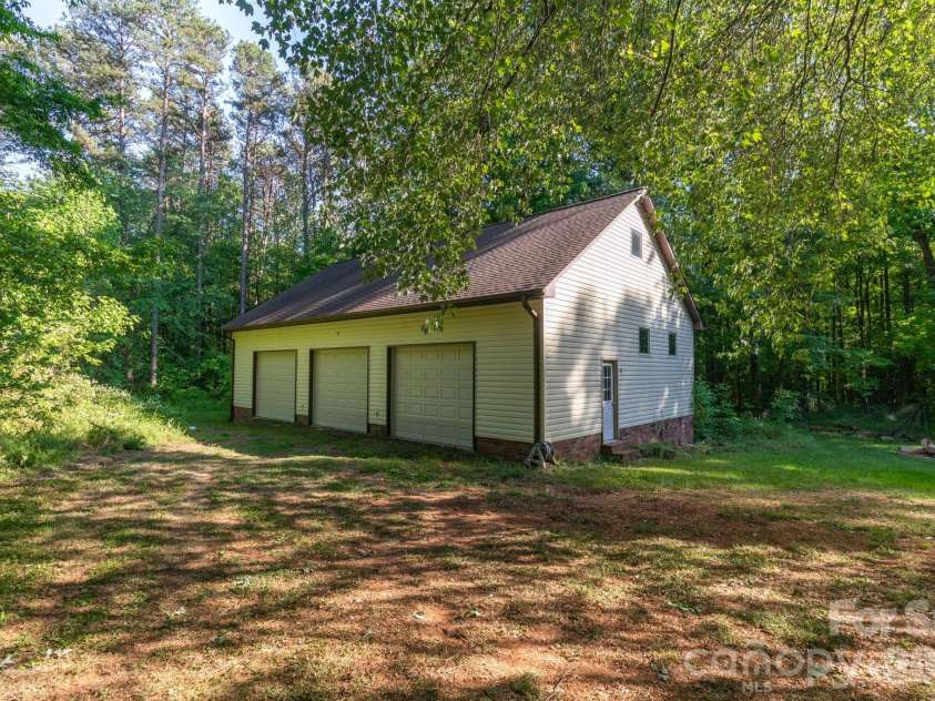 445 Quail Drive, Salisbury, NC 28147.  MLS# CAR4373863, YatesRealty ID 20272. Detached 3 car garage w/ unfinished loft