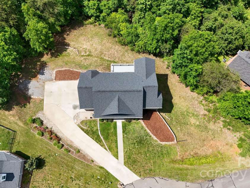 7768 Pinecone Lane, Hickory, NC 28602.  MLS# CAR4257441, YatesRealty ID 20276. Aerial of property driveway to garage