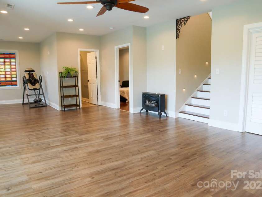 7768 Pinecone Lane, Hickory, NC 28602.  MLS# CAR4257441, YatesRealty ID 20276. Basement Family room looking towards stairs