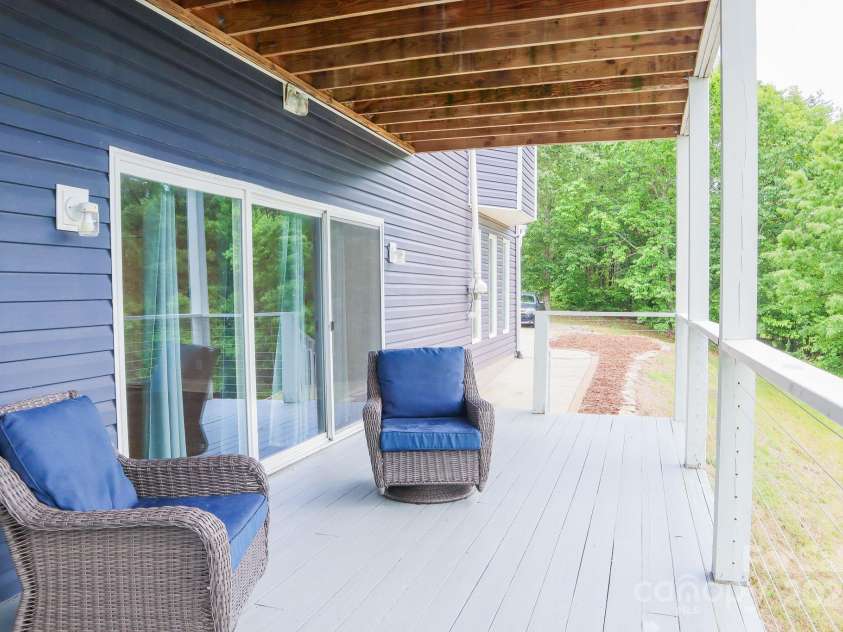 7768 Pinecone Lane, Hickory, NC 28602.  MLS# CAR4257441, YatesRealty ID 20276. Deck looking at back of home towards garage