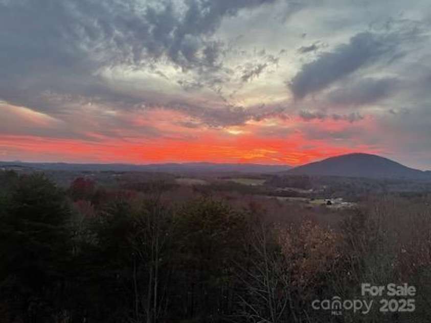 7768 Pinecone Lane, Hickory, NC 28602.  MLS# CAR4257441, YatesRealty ID 20276. View off deck sunset
