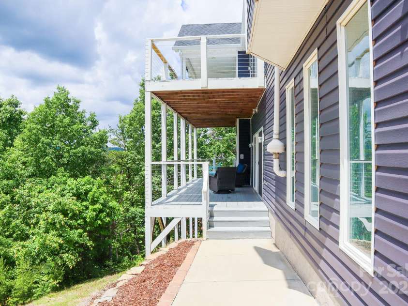7768 Pinecone Lane, Hickory, NC 28602.  MLS# CAR4257441, YatesRealty ID 20276. Walk way from garage to basement deck