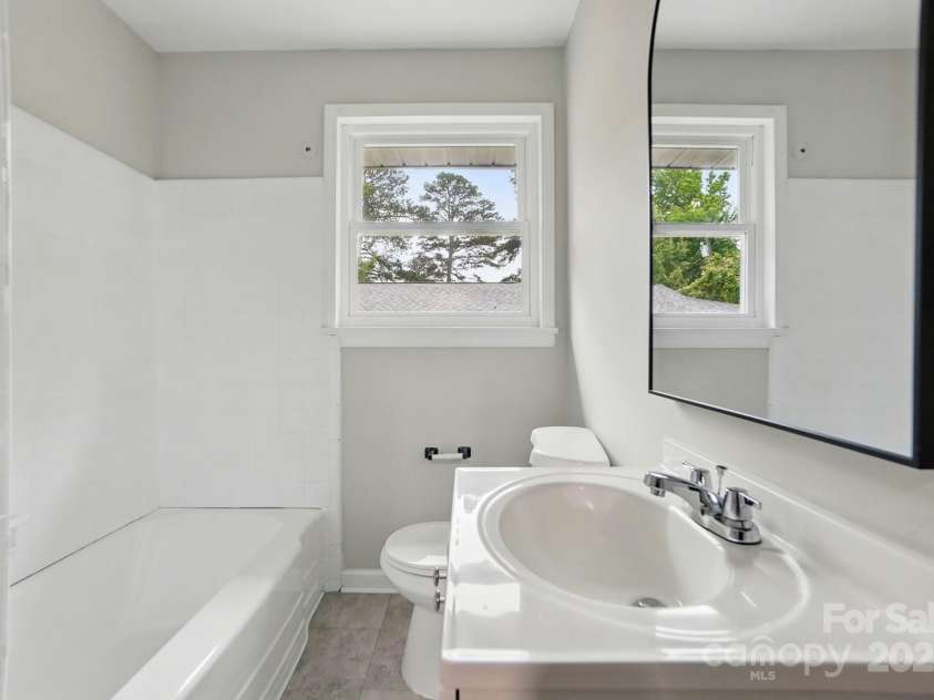 1412 Wembley Drive, Charlotte, NC 28205.  MLS# CAR4257976, YatesRealty ID 20281. Bathroom in 3bdrm unit